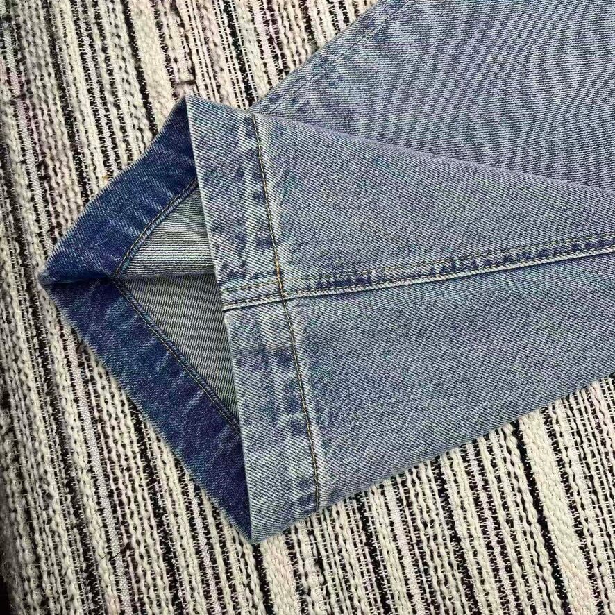 Embossed Logo Wide Leg Jeans